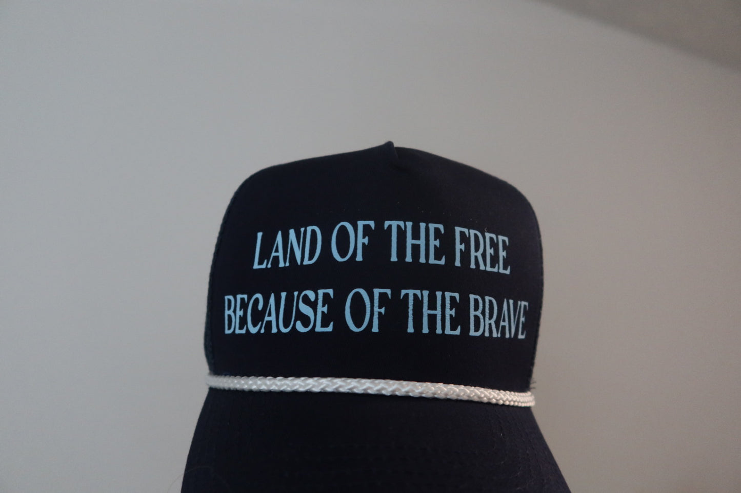 LAND OF THE FREE BECAUSE OF THE BRAVE-NAVY AND LIGHT BLUE HAT