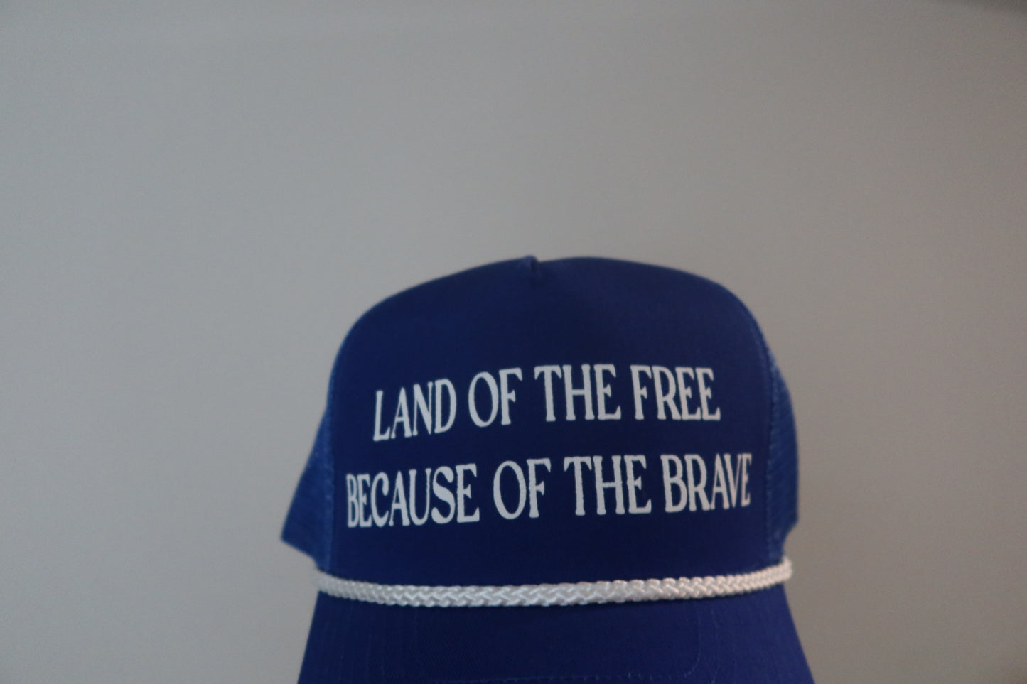 LAND OF THE FREE BECAUSE OF THE BRAVE-ROYAL BLUE AND WHITE HAT