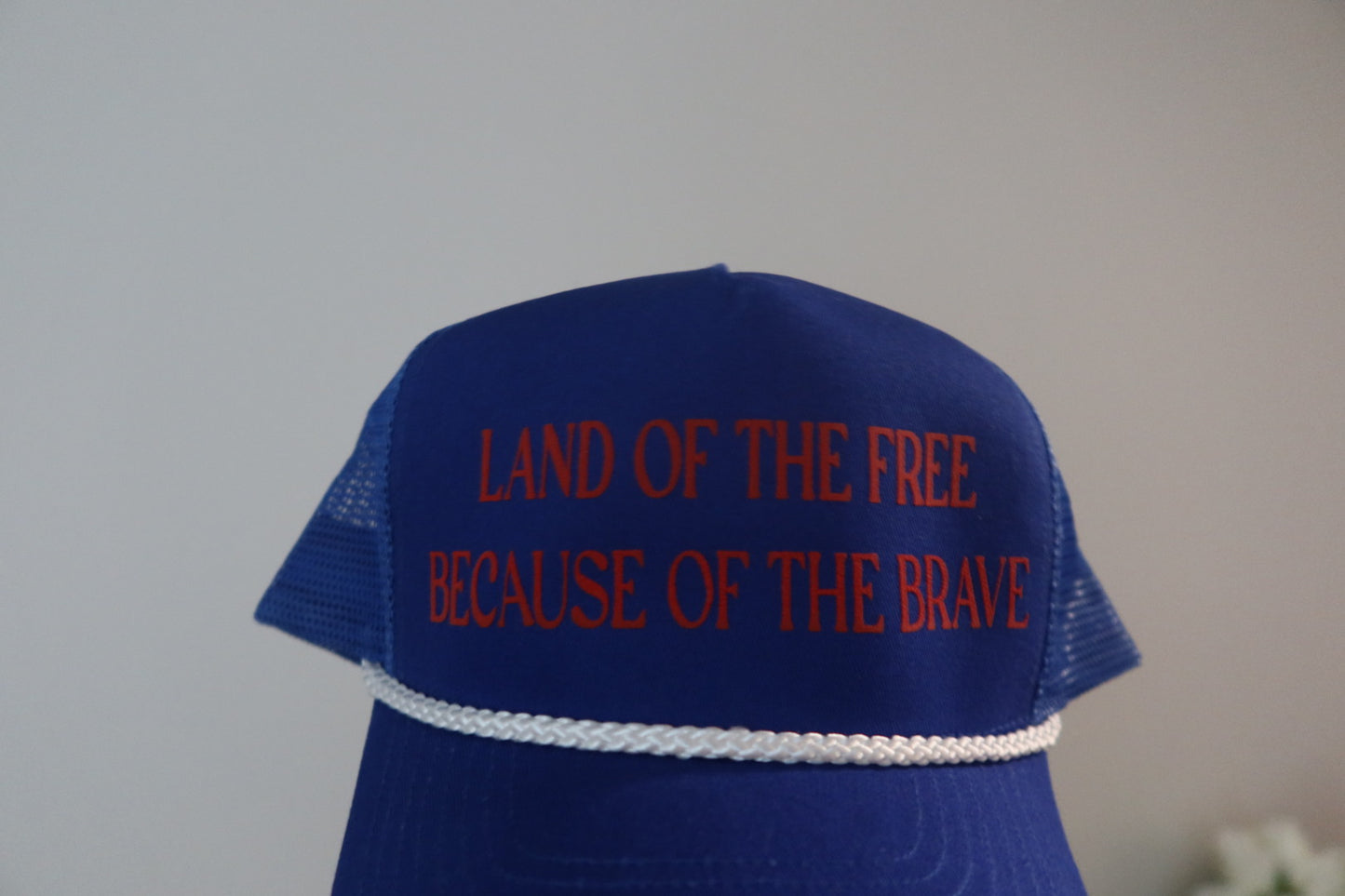 LAND OF THE FREE BECAUSE OF THE BRAVE-ROYAL BLUE AND RED HAT