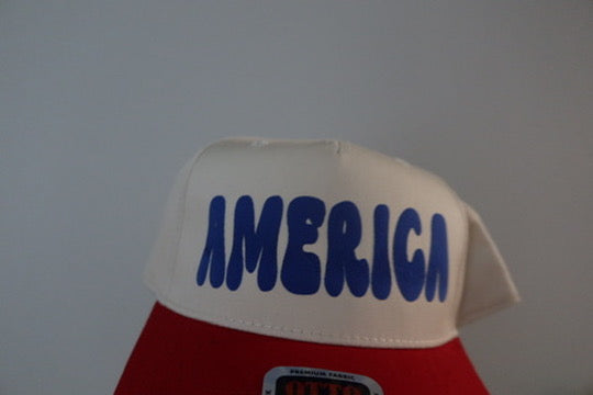 AMERICA- NATURAL WITH RED HAT