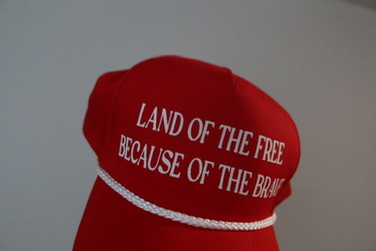 LAND OF THE FREE BECAUSE OF THE BRAVE-RED AND WHITE HAT