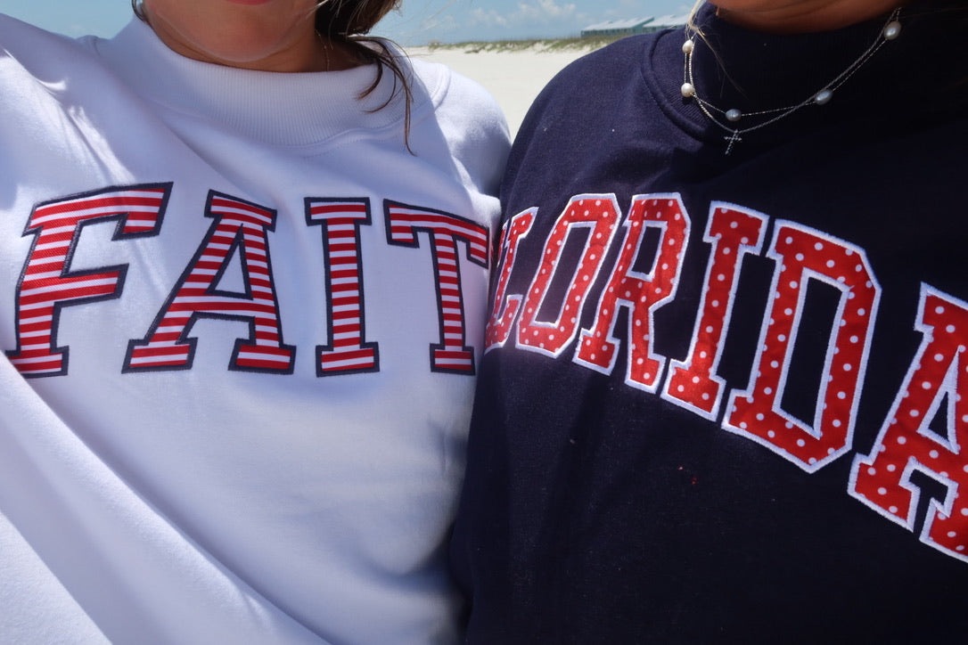 FLORIDA- TRUE NAVY AND RED POLKA DOT MOCK NECK