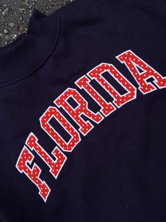 FLORIDA- TRUE NAVY AND RED POLKA DOT MOCK NECK