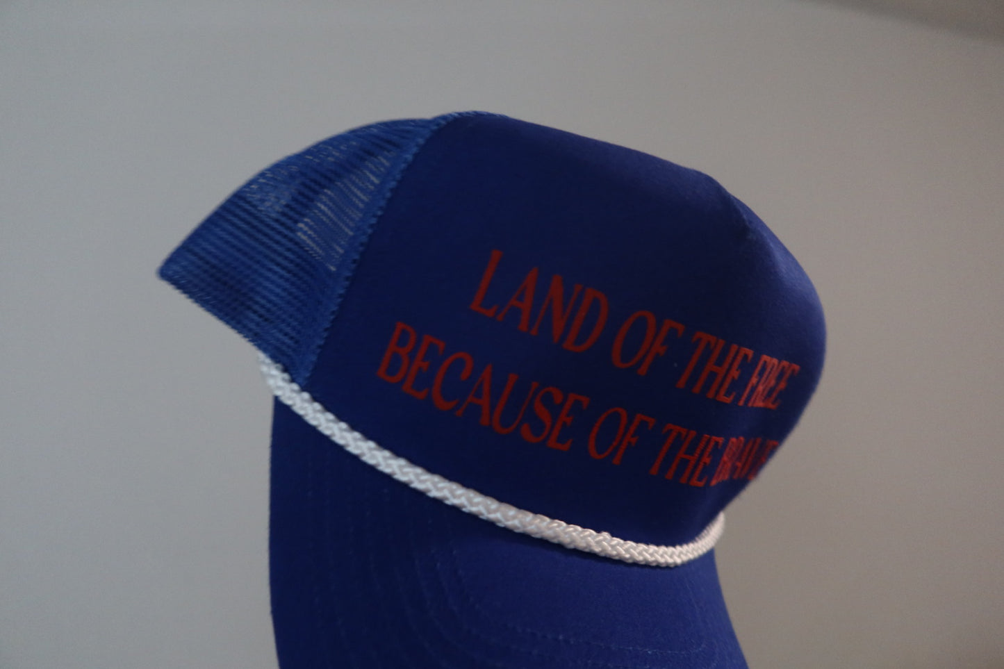 LAND OF THE FREE BECAUSE OF THE BRAVE-ROYAL BLUE AND RED HAT