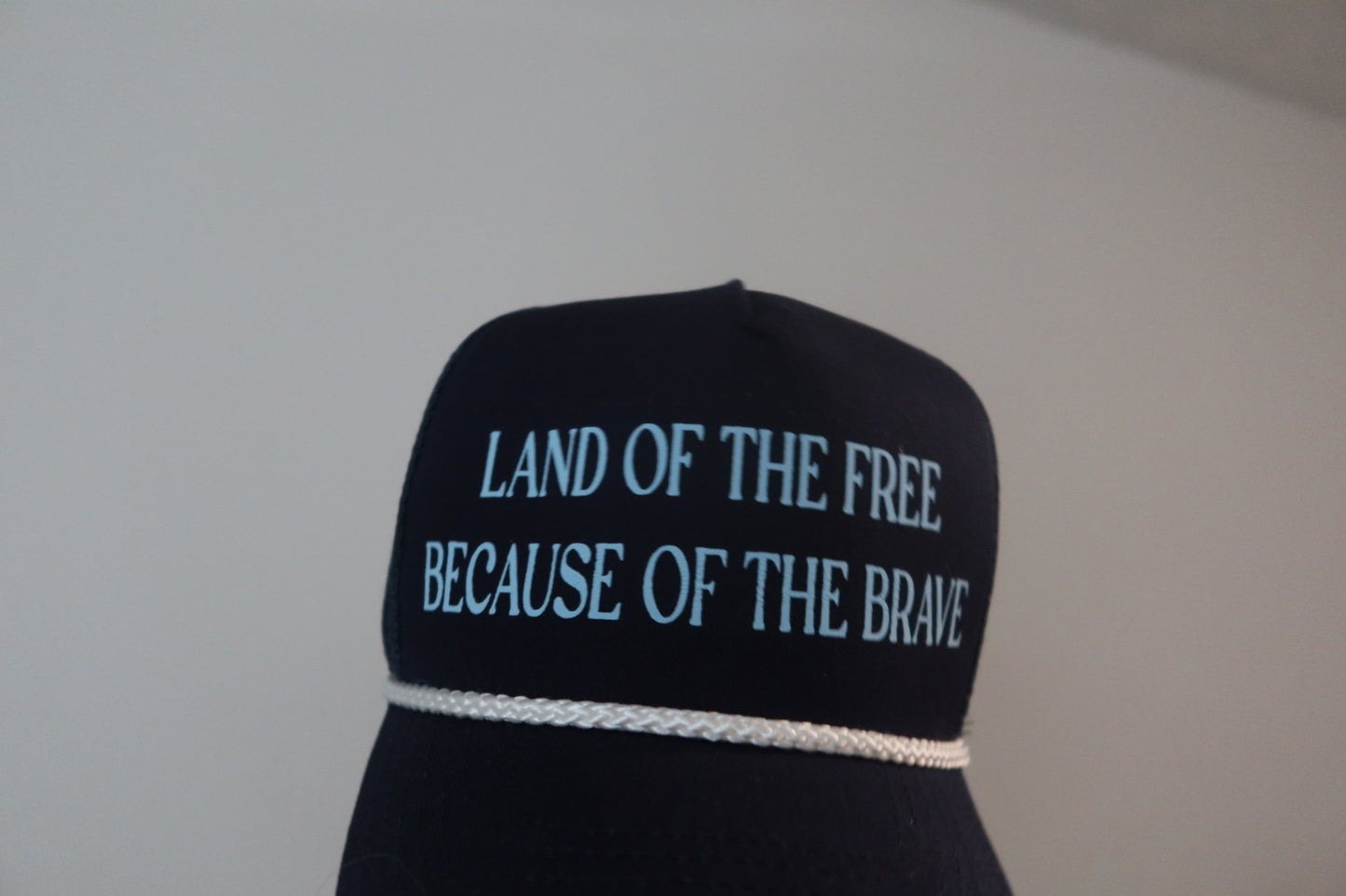 LAND OF THE FREE BECAUSE OF THE BRAVE-NAVY AND LIGHT BLUE HAT