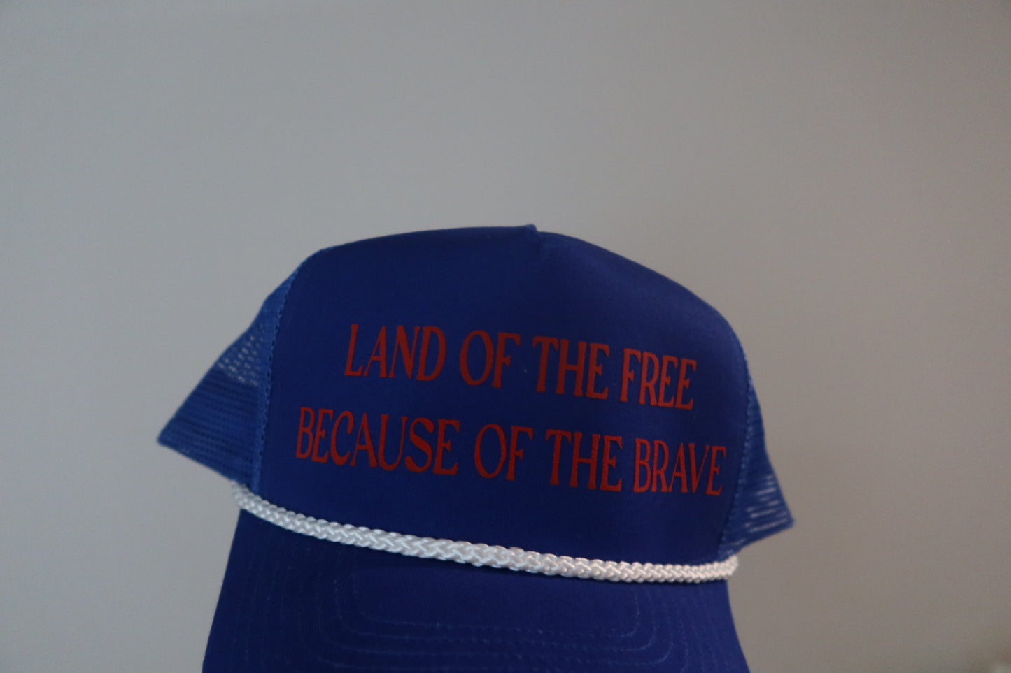 LAND OF THE FREE BECAUSE OF THE BRAVE-ROYAL BLUE AND RED HAT